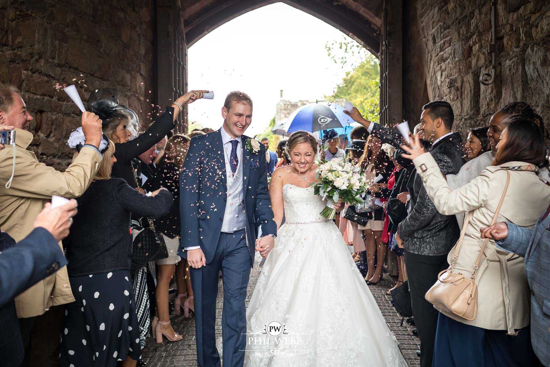 Berkley Castle Wedding Photography bride and groom confetti