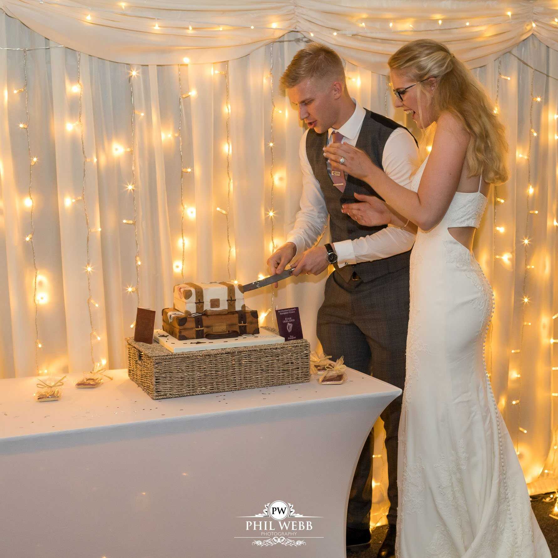 Borddesley Park Farm Wedding Photography cutting the wedding cake