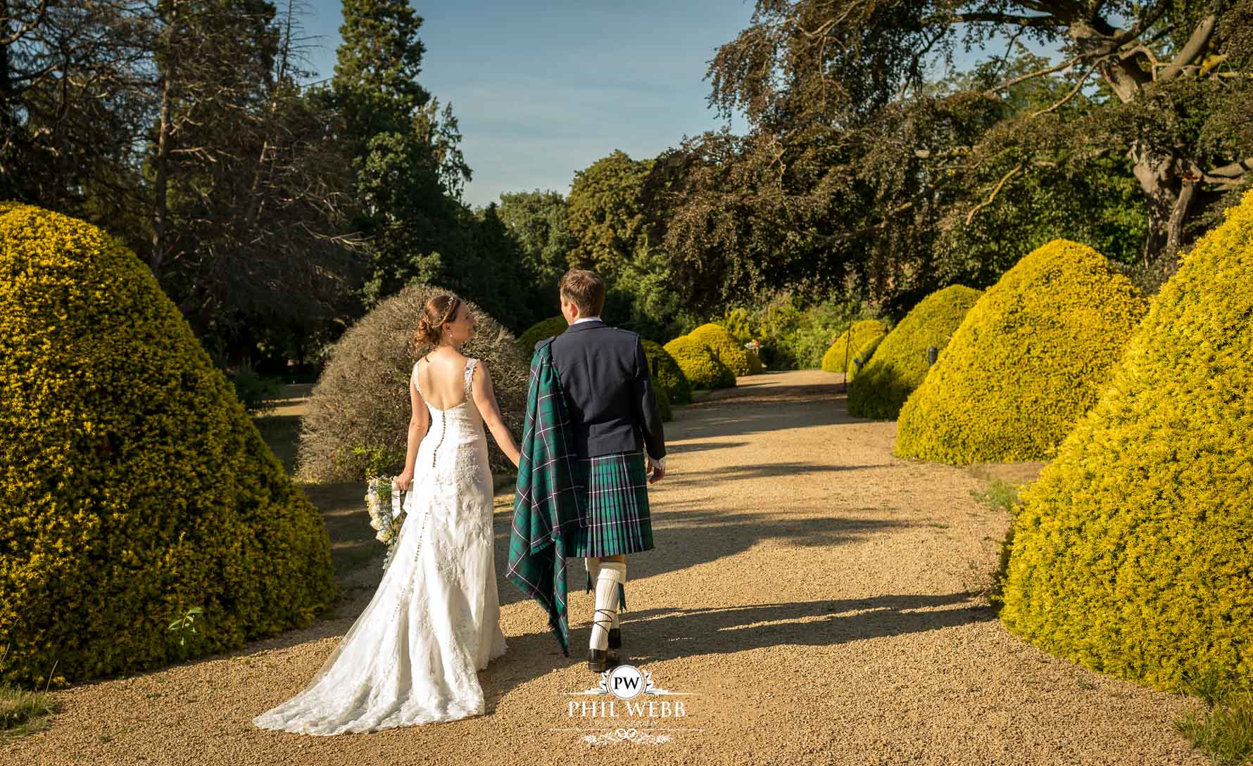 Manor by the Lake Wedding Photography bride and groom walking