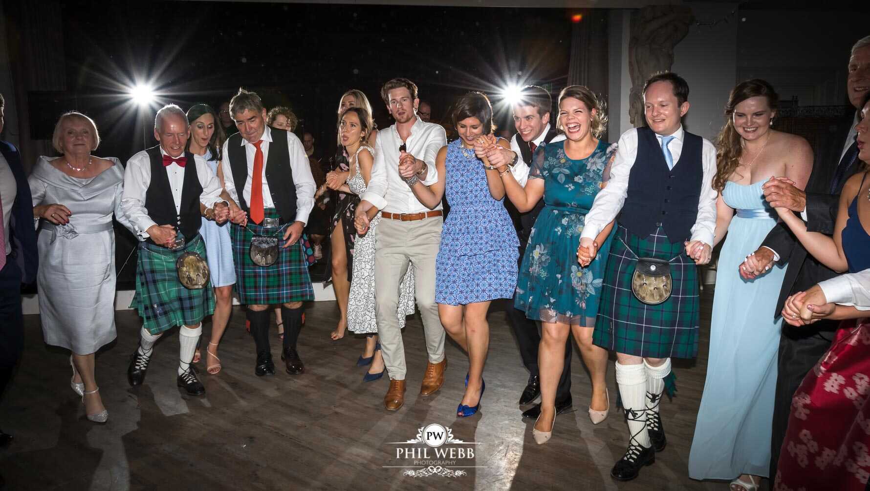 Manor by the Lake Wedding Photography bride and grooms guests dancing