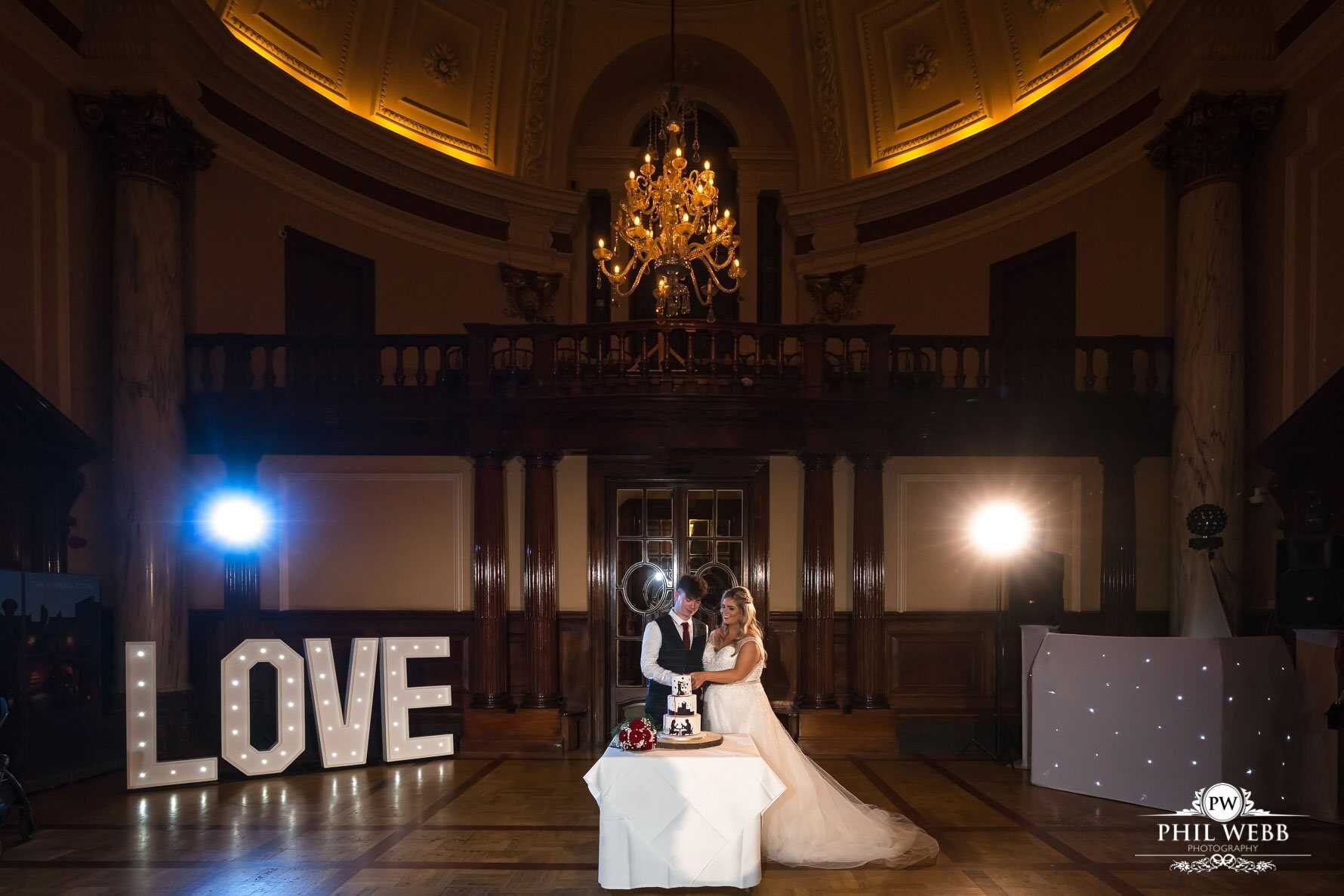 Roman Baths Wedding Photography bride and groom cutting wedding cake