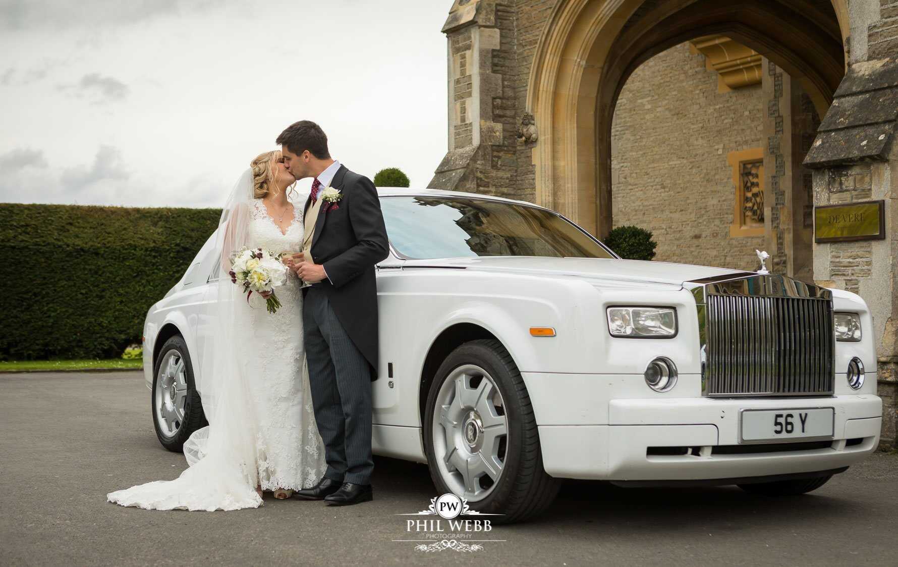 Tortworth Court Wedding Photography bride and groom portrait with Rolls Royce