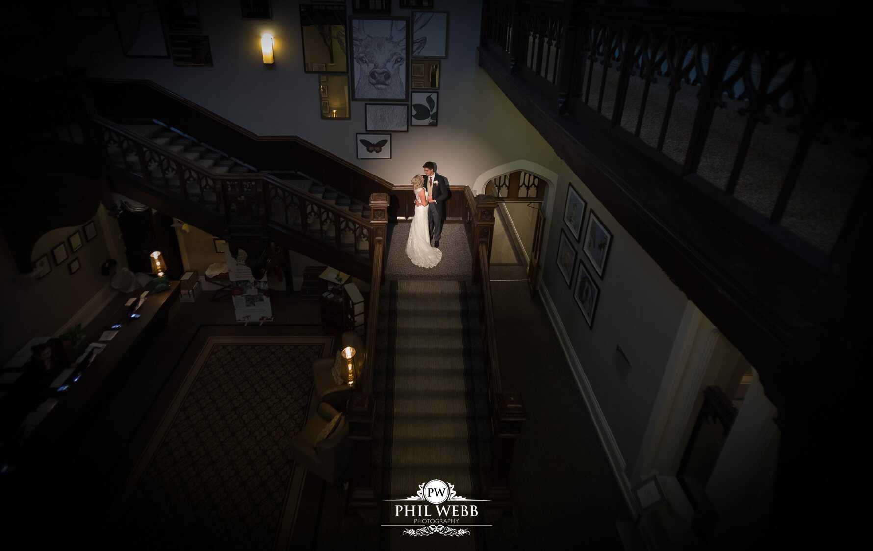 Tortworth Court Wedding Photography bride and groom portrait on the stairs