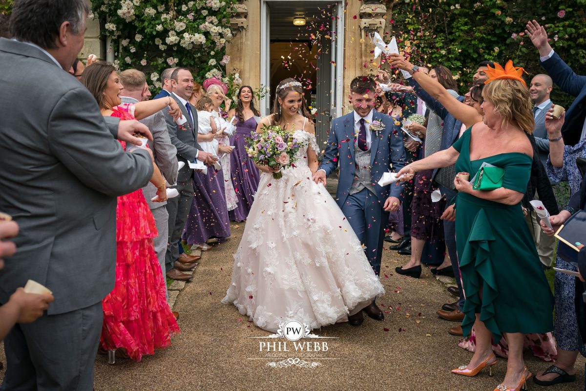 Clevedon Hall Wedding Photography bride and groom confetti