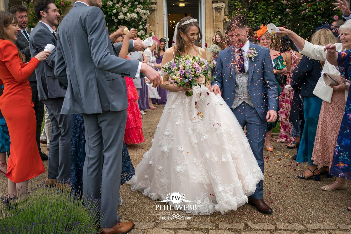 Clevedon Hall Wedding Photography bride and groom confetti