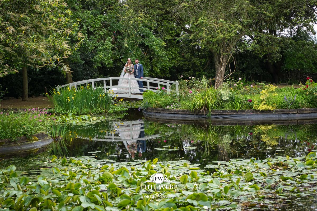 Clevedon Hall Wedding Photography bride and groom portrait by the lake