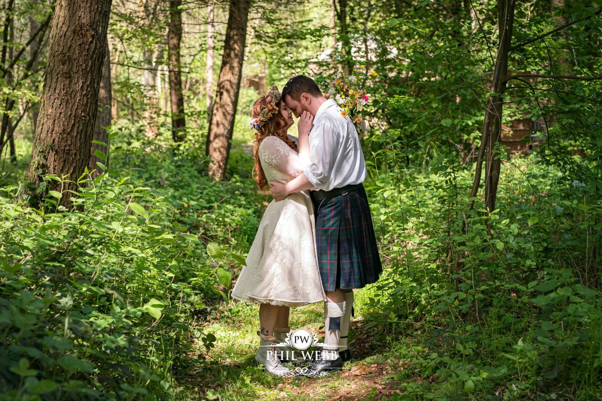 Enchanted Woodland Wedding Hereford bride and groom kiss