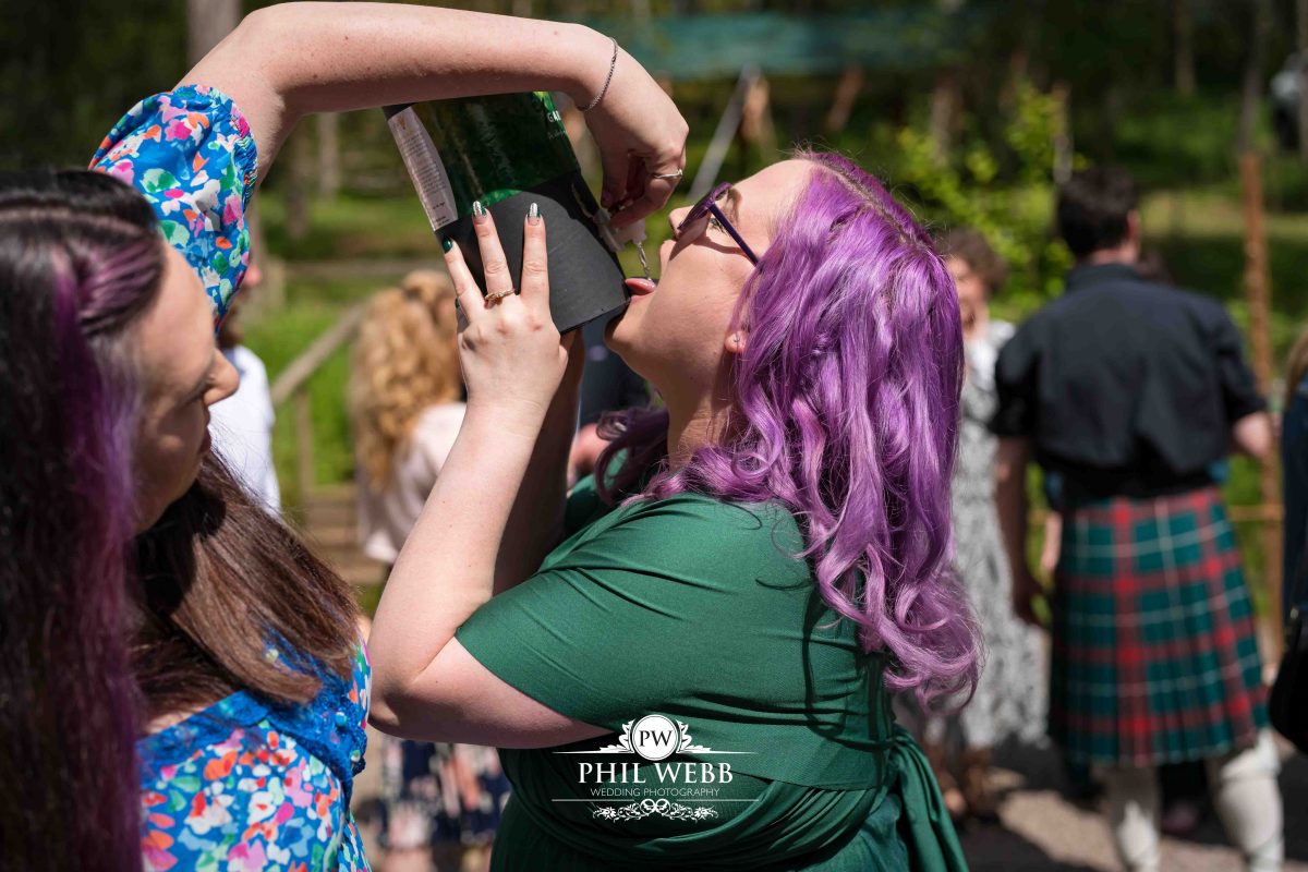 Enchanted Woodland Wedding Hereford bridesmaid drinking from carton