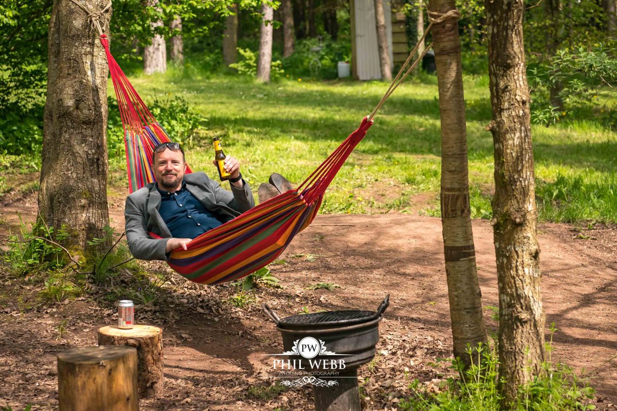 Enchanted Woodland Wedding Hereford reception guest in hammock