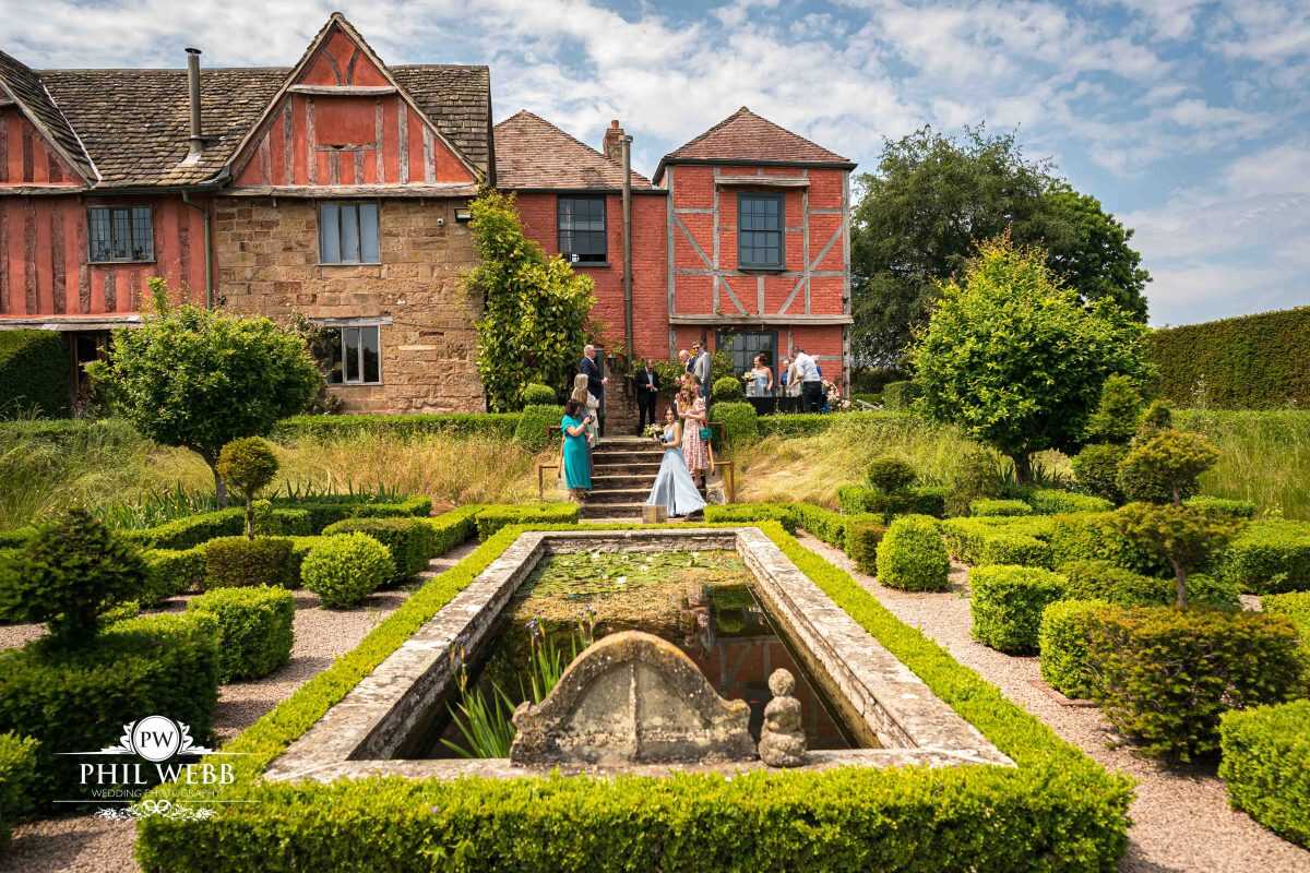 Pauntley Court Wedding Venue bride and groom confetti