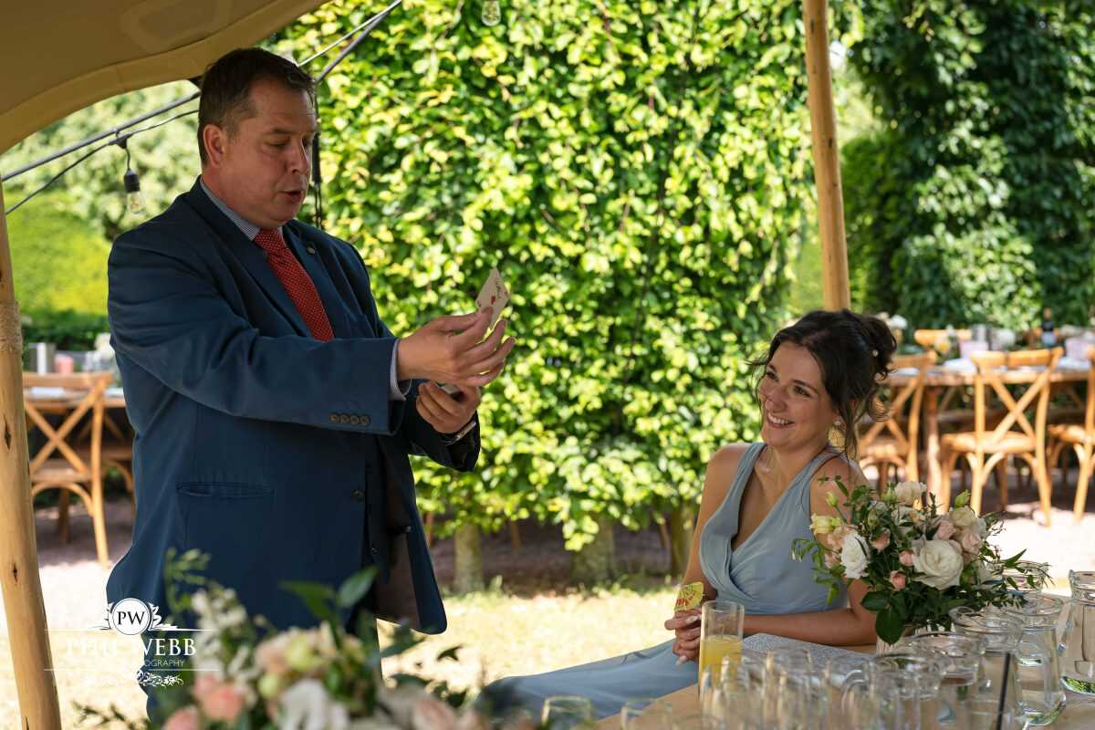 Pauntley Court Wedding Venue bride and groom with magician