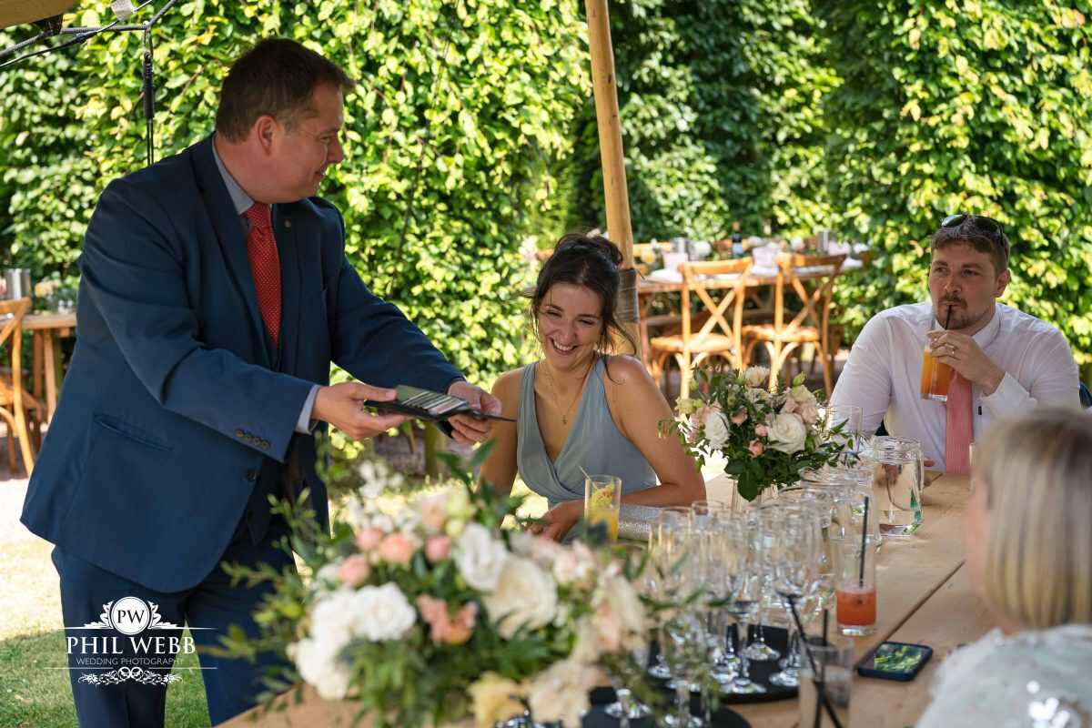 Pauntley Court Wedding Venue bride and groom with magician
