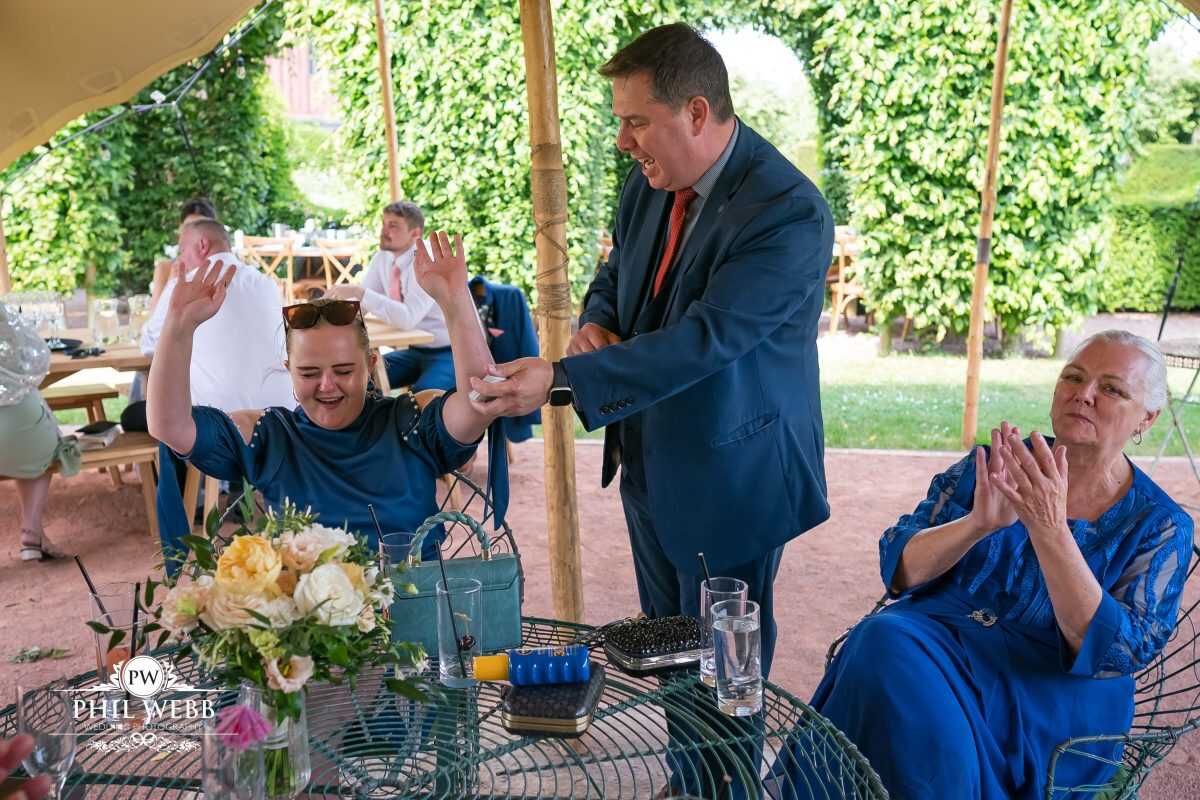 Pauntley Court Wedding Venue bride and groom with magician