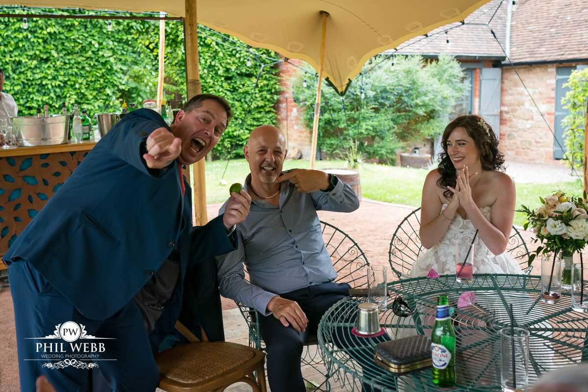 Pauntley Court Wedding Venue bride and groom with magician
