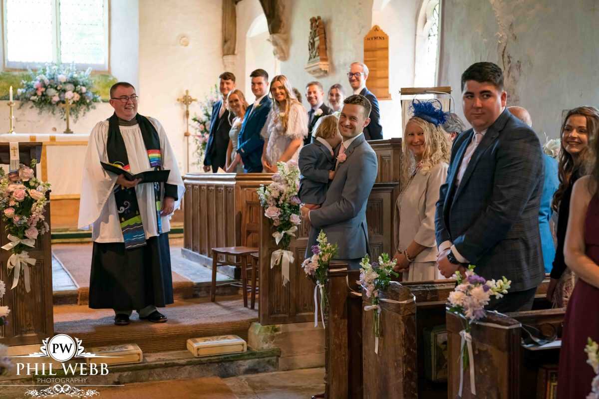 groom waiting for bride church wedding ceremony