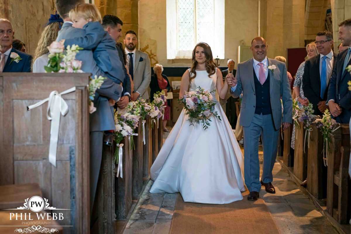 bride walking down the aisle church wedding ceremony