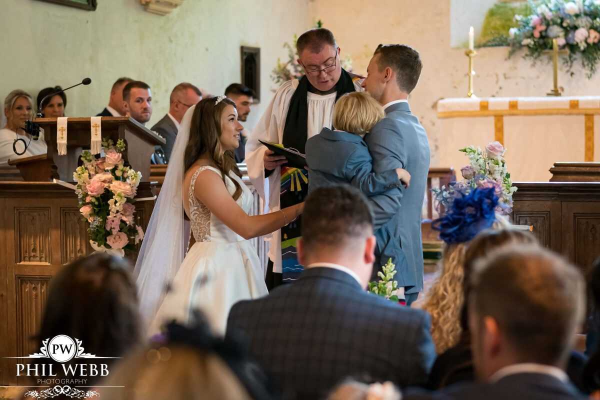 bride and groom wedding ring exchange in church