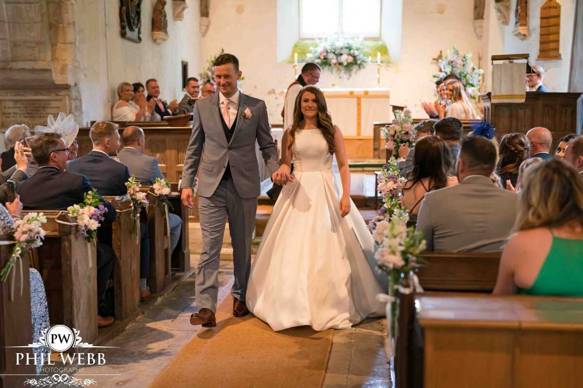 bride and groom leaving church