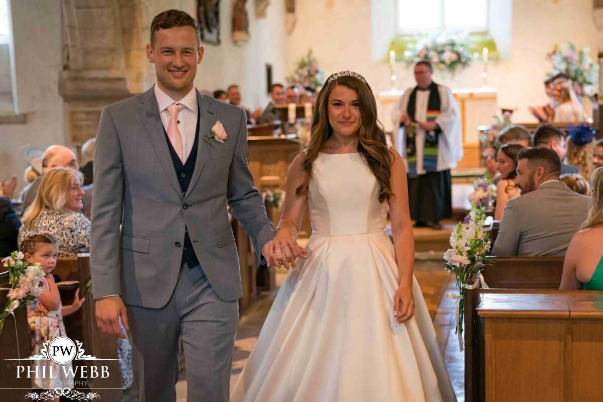 bride and groom leaving church