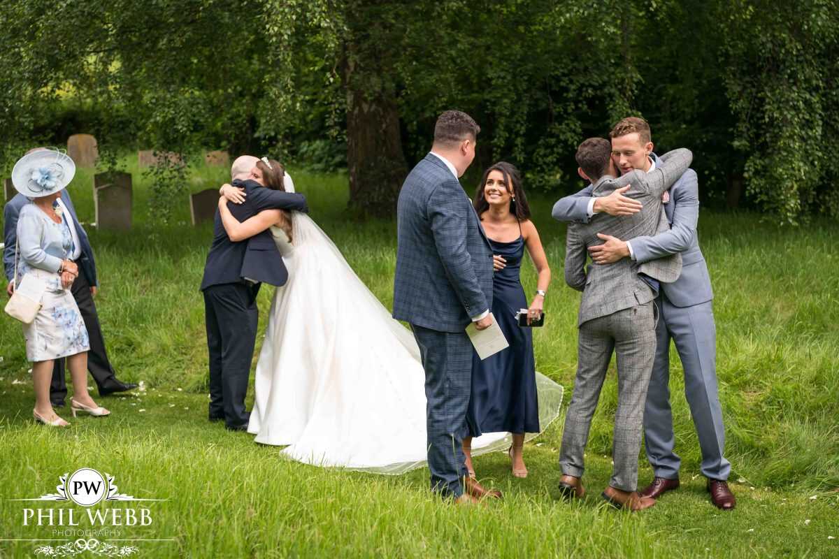 Bride and Groom being congratulated by their guests
