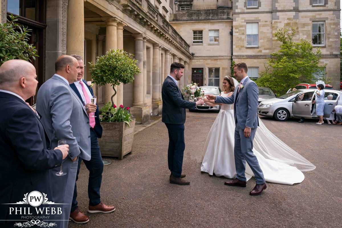 Bride and Groom arriving at Cowley Manor
