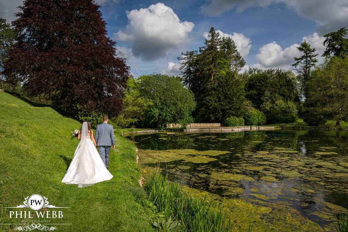 Bride and Groom Portrait at Cowley Manor by the lake