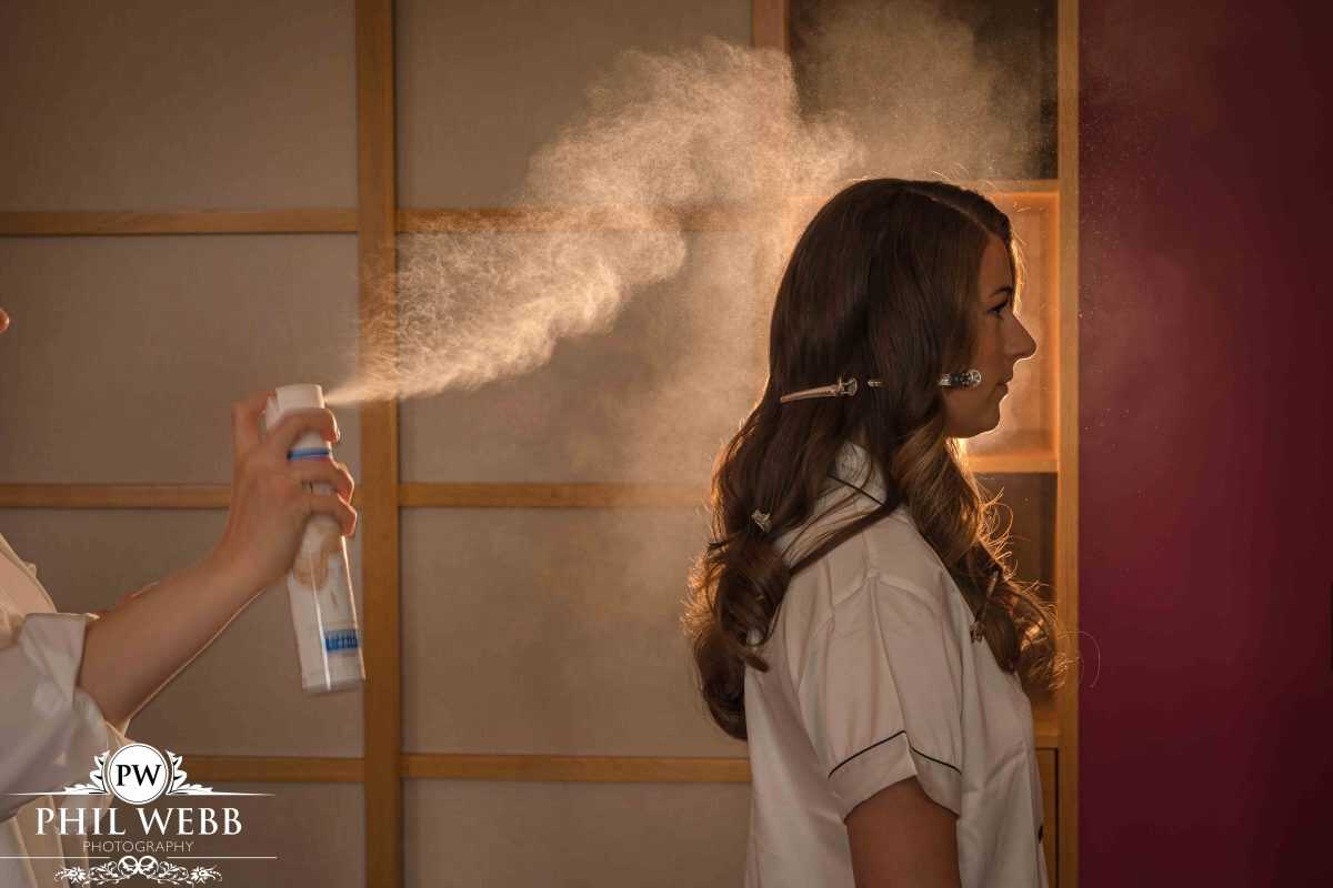 bride having hairspray