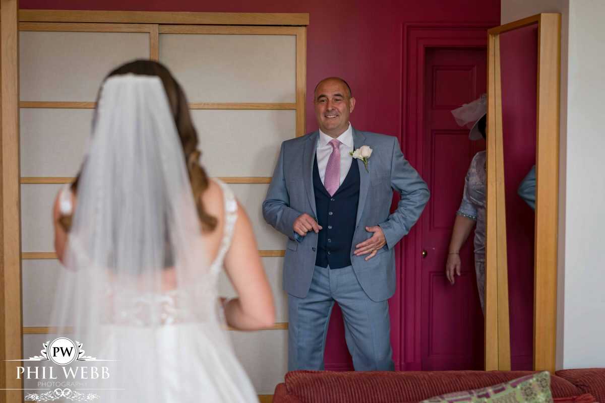 dads first look of his daughter prior to wedding ceremony