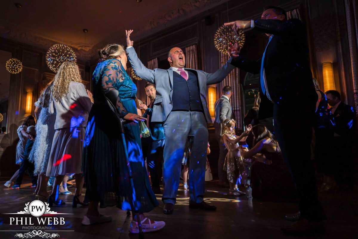 wedding guests dancing at evening party