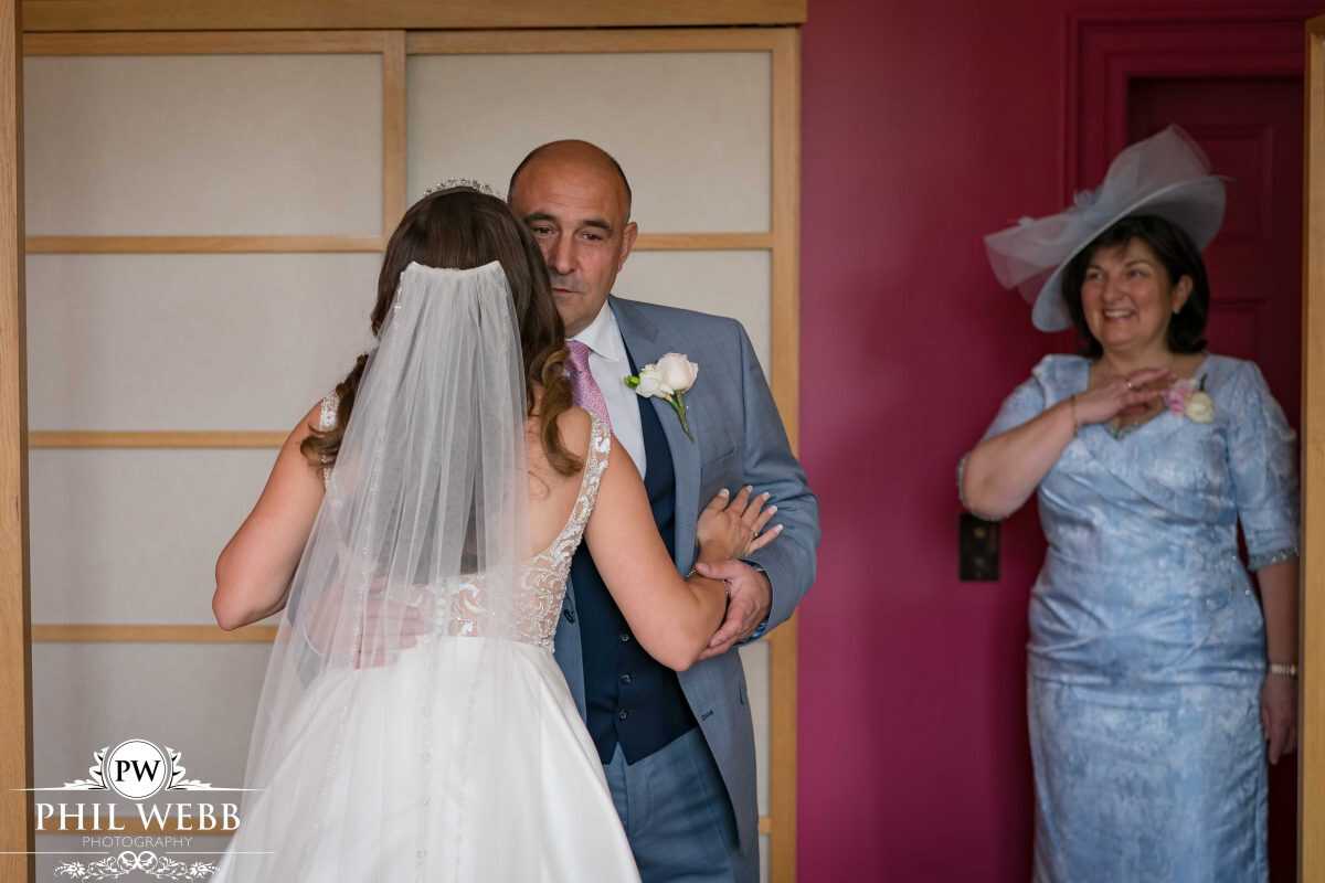 dads first look of his daughter prior to wedding ceremony