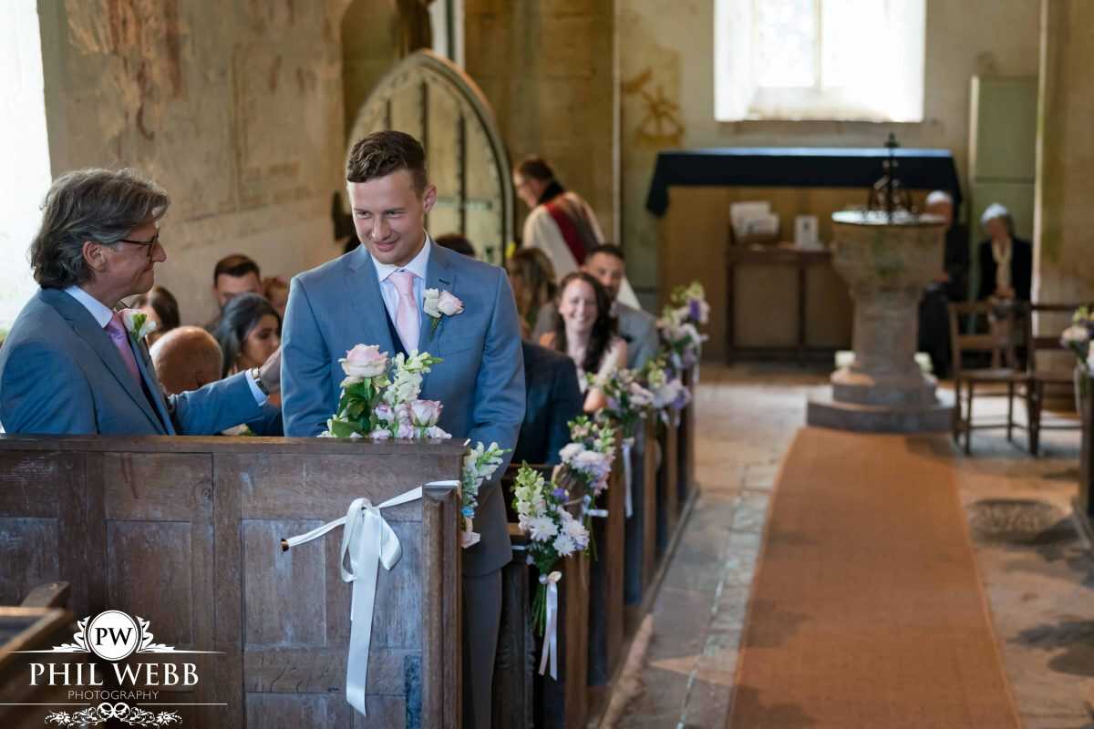 groom waiting for bride church wedding ceremony