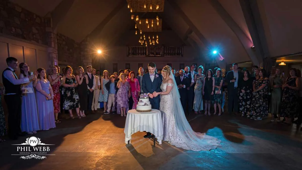 The Frogmill Wedding Photography bride and groom cutting wedding cake