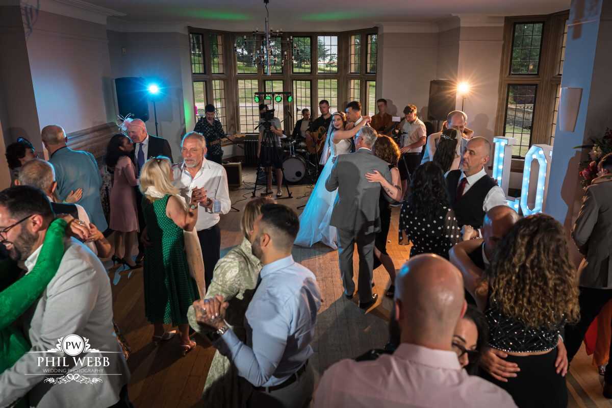 Coombe Lodge Wedding Photography bride dancing with friends