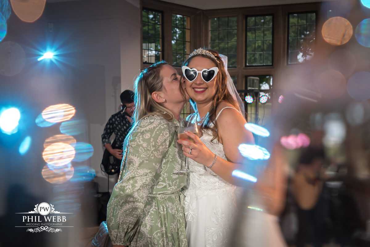 Coombe Lodge Wedding Photography bride dancing with friends