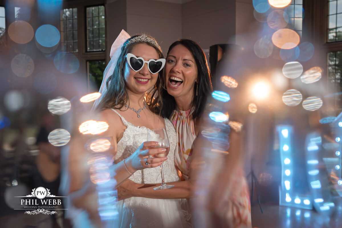 Coombe Lodge Wedding Photography bride dancing with friends