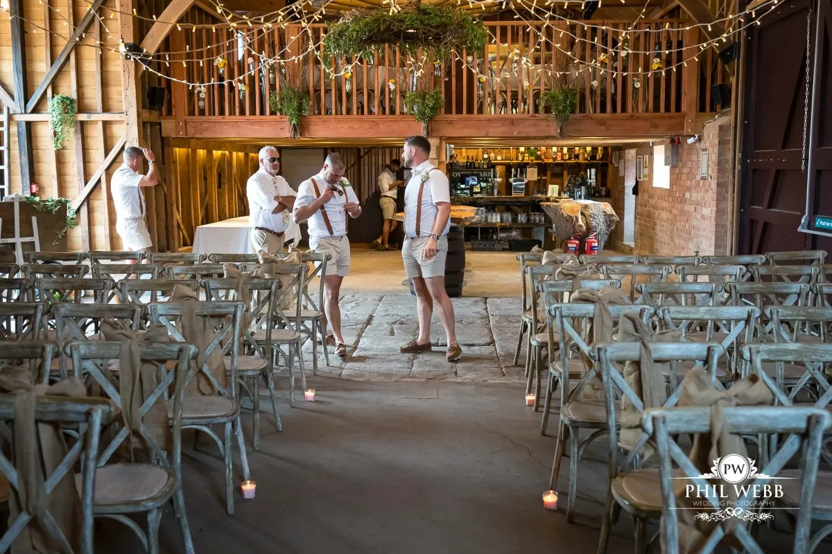 Over barn at Over Farm Wedding Photography bride and groom indoor ceremony