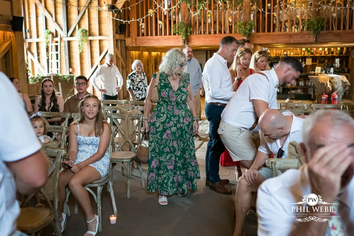 Over barn at Over Farm Wedding Photography bride and groom indoor ceremony