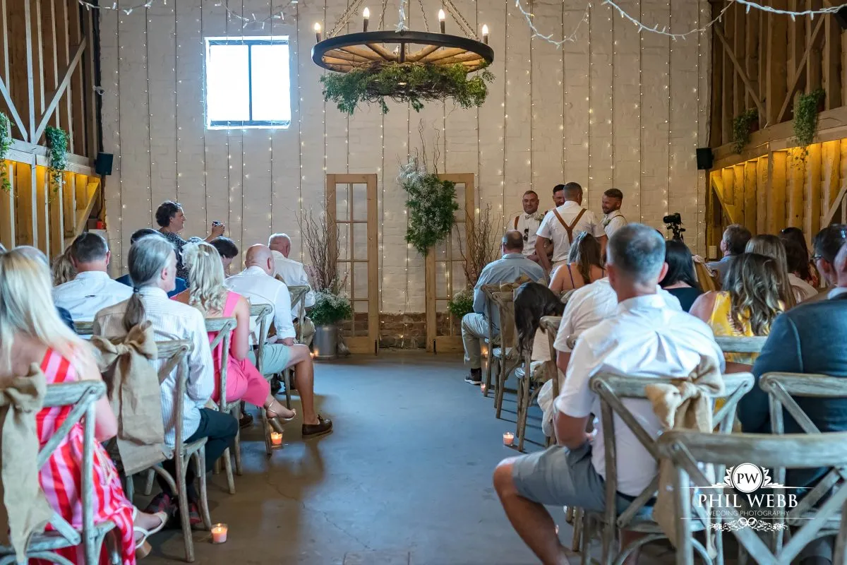 Over barn at Over Farm Wedding Photography bride and groom indoor ceremony