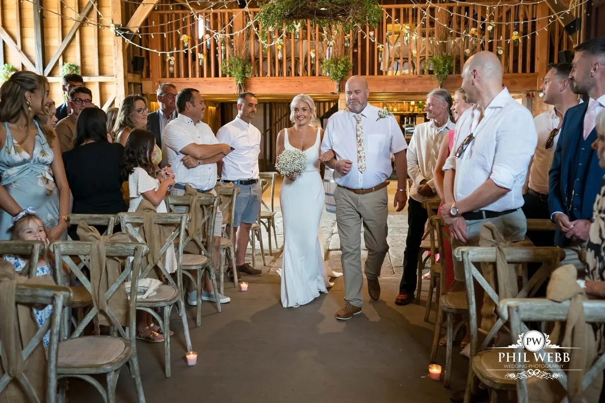 Over barn at Over Farm Wedding Photography bride and groom indoor ceremony
