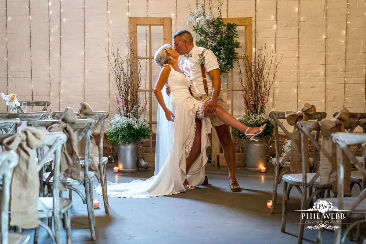 Over barn at Over Farm Wedding Photography bride and groom indoor ceremony
