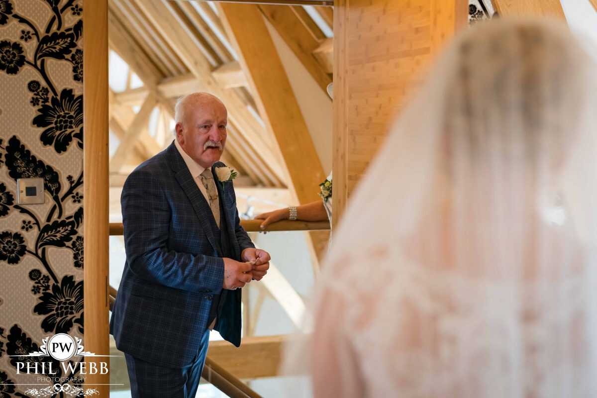 bride prep at Red House Barns Wedding Venue dads first look