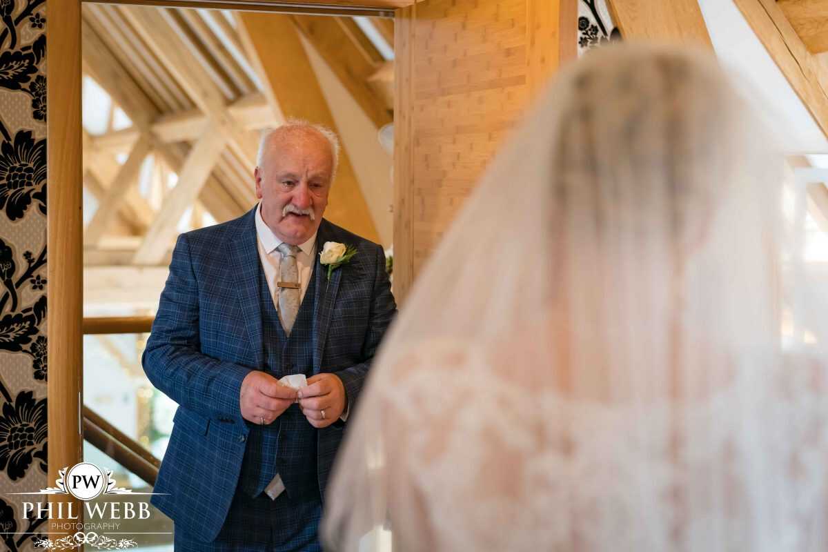 bride prep at Red House Barns Wedding Venue dads first look