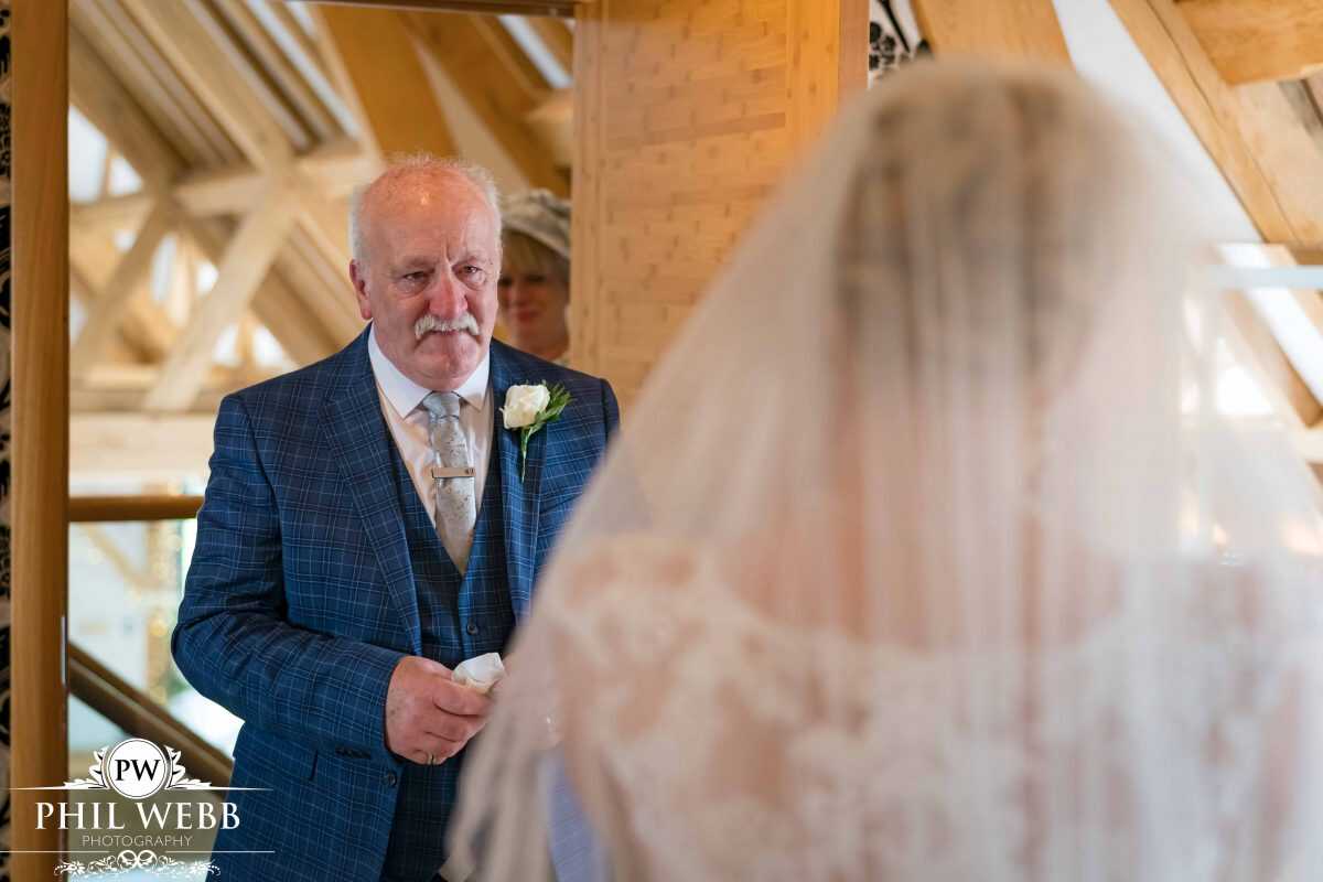 bride prep at Red House Barns Wedding Venue dads first look