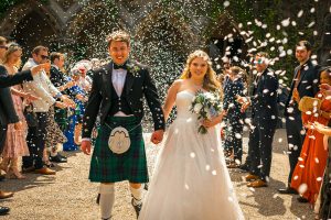Bride and Groom under confetti shower