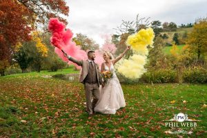 Dumbleton Hall Wedding Photography bride and groom portrait smoke bomb