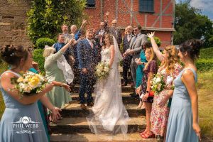Pauntley Court Wedding Venue bride and groom confetti