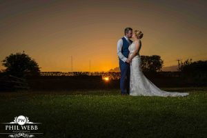 bride and groom sunset portrait