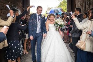 Berkley Castle Wedding Photography bride and groom confetti